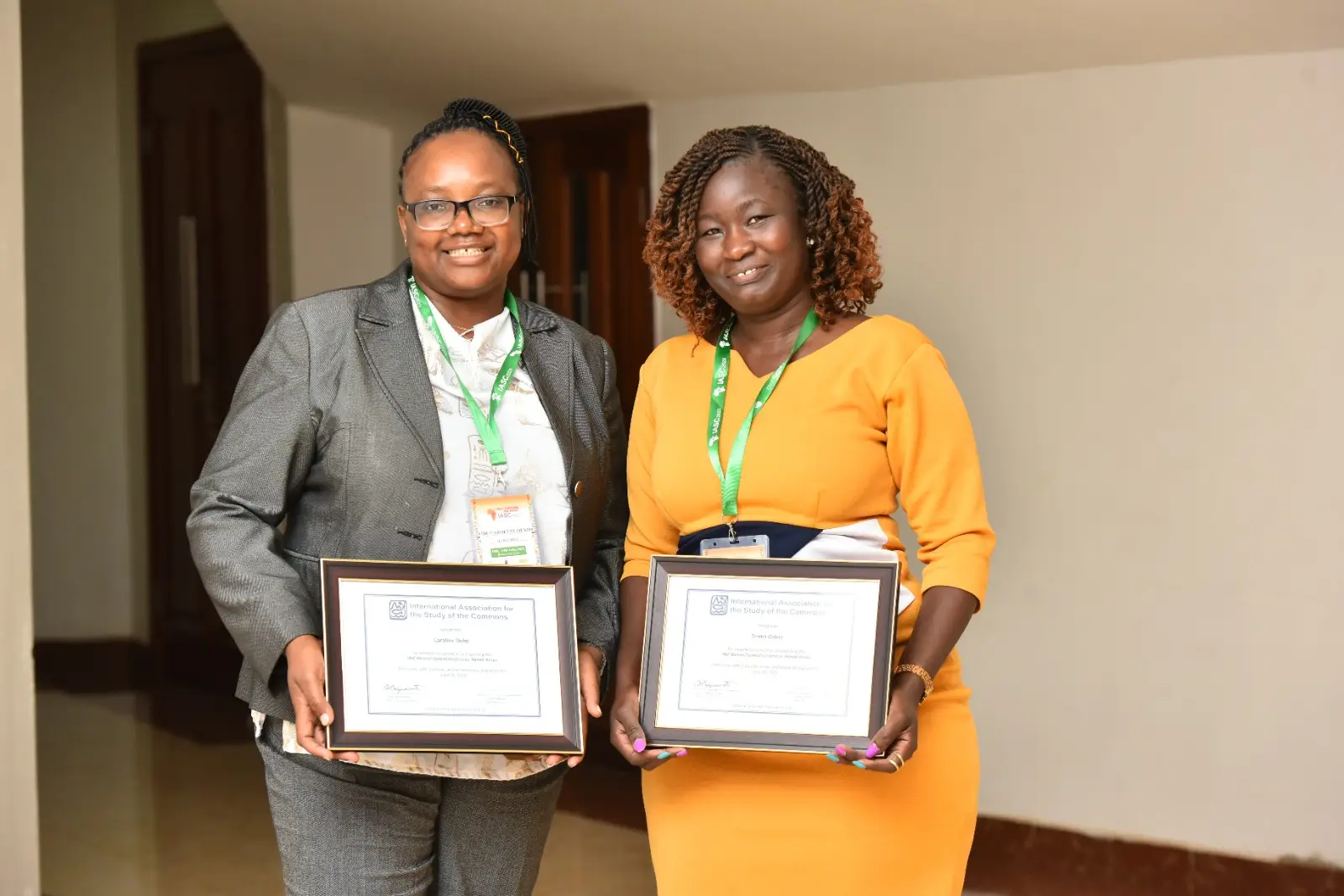 Dr. Caroline Ouko and Emma Odera from CETRAD pose for a photo after being honored with certificates of excellence during the IASC Conference Dr. Caroline Ouko and Emma Odera from CETRAD pose for a photo after being honored with certificates of excellence during the IASC Conference